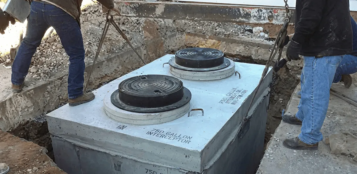 Grease trap installation for a commercial property drainage system in Grand Rapids, MI