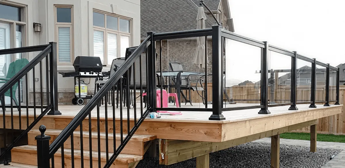 Handrail installation on a deck staircase for safety and code compliance in Grand Rapids, MI